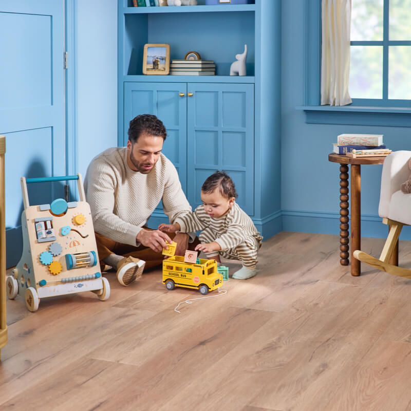 Dad child playing with toys | America's Carpet Outlet